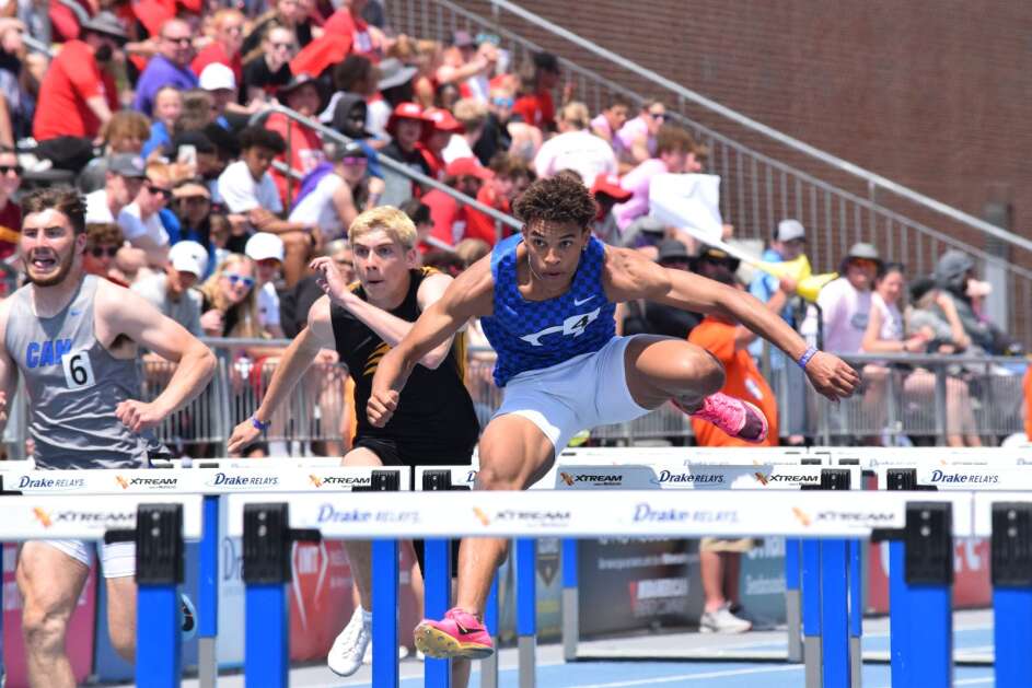 Triston Miller goes over a hurdle during his state championship 110-meter hurdle run at the Iowa High School Track and Field Championship. (Hunter Moeller/The Union)