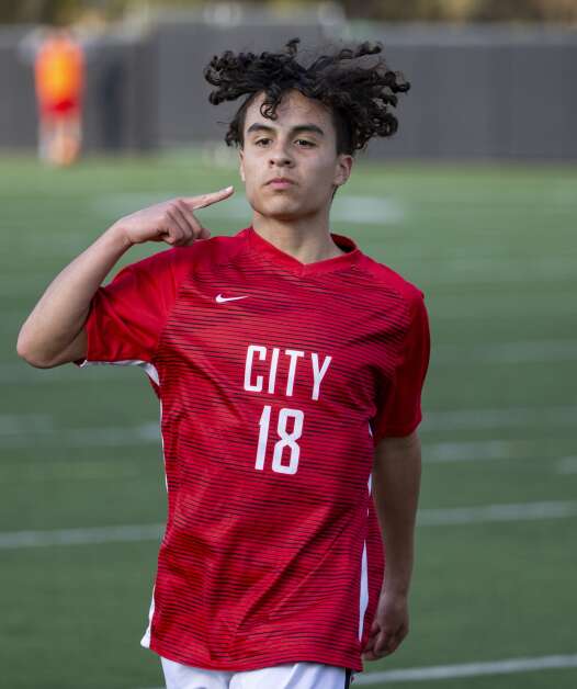 City High Little Hawks midfielder Josh Borger-Germann (18) puts up a finger in celebration after scoring the first goal for the Little Hawks in the second half of the game at Iowa City High in Iowa City, Iowa on Tuesday, April 25, 2023. (Savannah Blake/The Gazette)