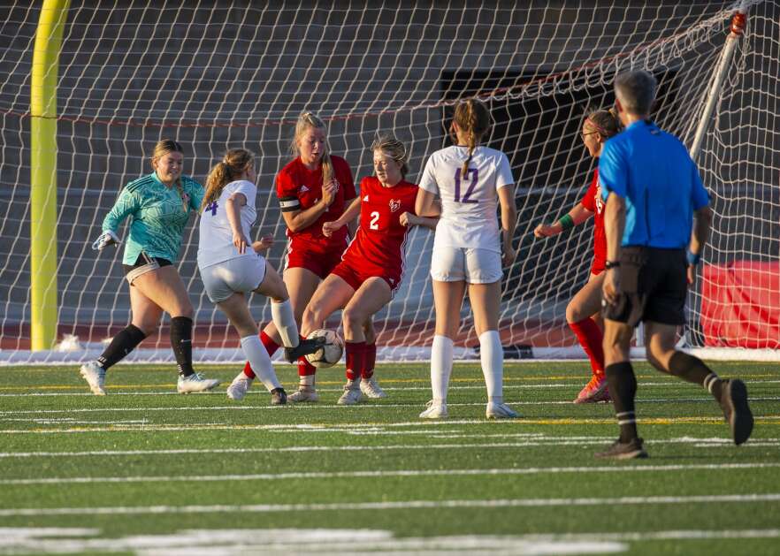 Marion defender Katelyn Allison (2) blocks the shot from Iowa City Liberty midfielder Rilyn Breinholt (4) in the first half of the game at Marion High School in Marion, Iowa on Thursday, May 25, 2023. (Savannah Blake/The Gazette)