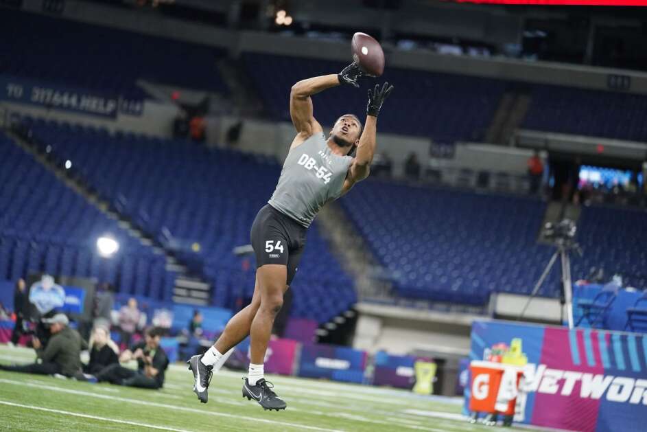 Iowa defensive back Kaevon Merriweather runs a drill at the NFL football scouting combine in Indianapolis, Friday, March 3, 2023. (AP Photo/Michael Conroy)