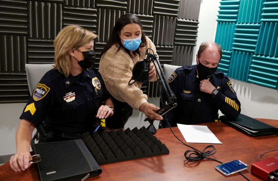Cedar Rapids Prairie senior Alexus Gause sets up a microphone for Cedar Rapids Police Department Community Outreach Officer Sgt. Laura Faircloth and Police Chief Wayne Jerman prior to recording the first episode of the social justice podcast “Power and Peace” at Iowa BIG in Cedar Rapids on Tuesday, April 27, 2021. (Cliff Jette/Freelance for the Gazette)