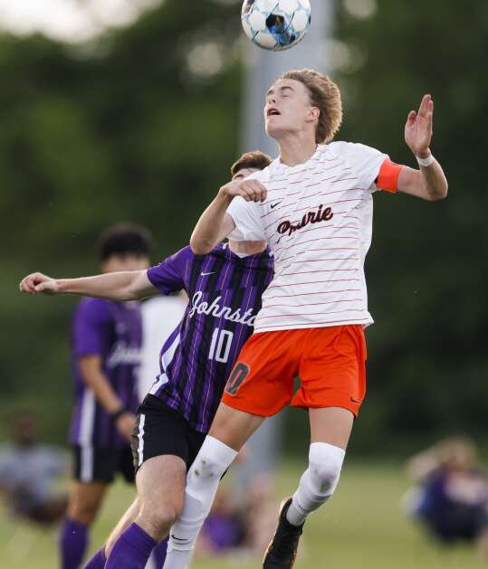 Prairie's Gavin Lewis (10) heads the ball in front of Johnston's Amer Oric (10) during their 4A quarterfinal match at the 2023 IHSAA State Soccer Tournament at Cownie Soccer Park in Des Moines, Iowa, on Wednesday, May 31, 2023. (Jim Slosiarek/The Gazette)