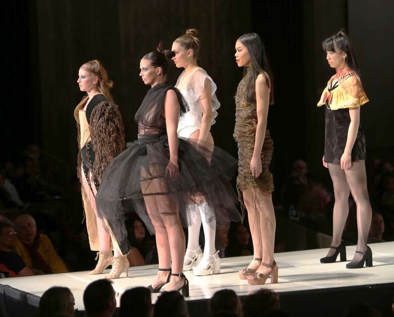 Models wearing "Feral" by Gloria Aguilar pose April 15 at The Fashion Show at Iowa State University’s Stephens Auditorium. (Bailey Cichon/The Gazette)