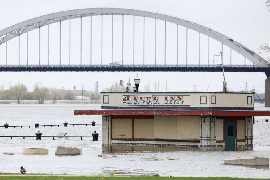 The Levee Inn is partially submerged by the rising Mississippi River on Monday in Davenport. (Niko Frazer/Quad City Times via AP)