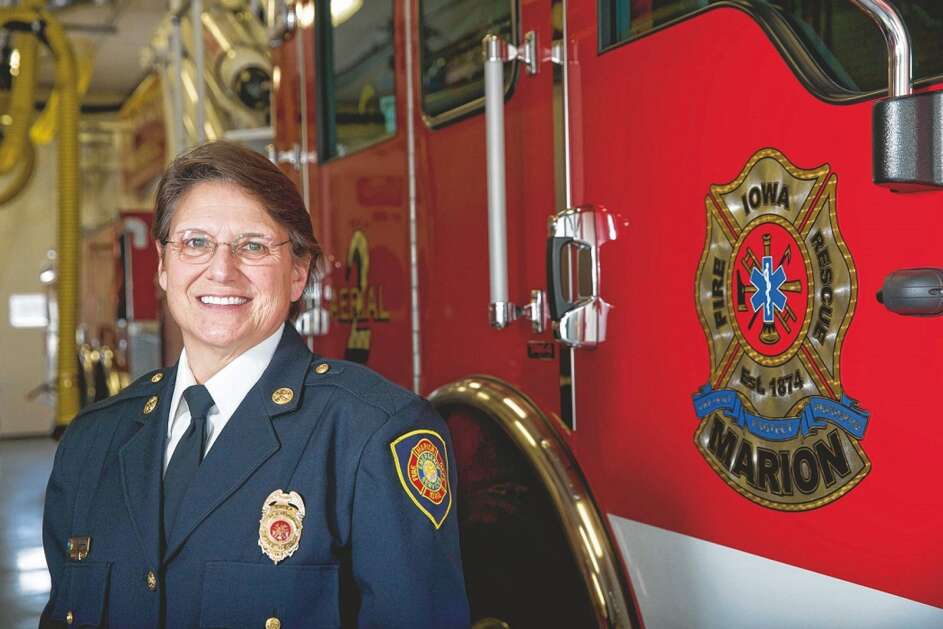 Marion Fire Chief Debra Krebill stands next to a new aerial fire truck in February 2019. Krebill was a Marion firefighter for 23 years before being named chief in July 2014, the second woman to be a career fire chief in the state. She retired in April 2022. (The Gazette)