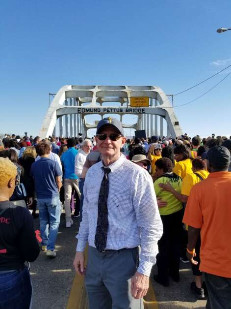 Dave Markward stands near the Edmund Pettus Bridge in Selma, Alabama, before a march for voting rights. The experience led him to write the book, “From Dubuqe to Selma and Beyond: My Journey to Understand Racism in America.” (Dave Markward)