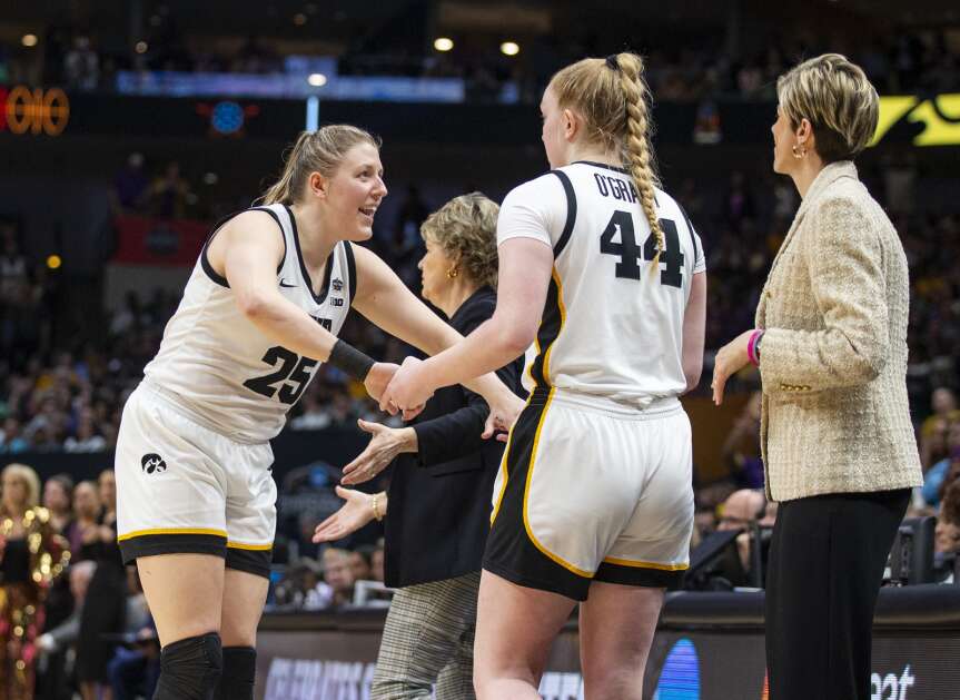 Iowa’s Monika Czinano (25) smiles as Addison O'Grady (44) takes over for her on the court in last year’s NCAA women’s basketball championship game in Dallas. With Czinano graduated, O’Grady is the likely heir apparent in the post. (Savannah Blake/The Gazette)