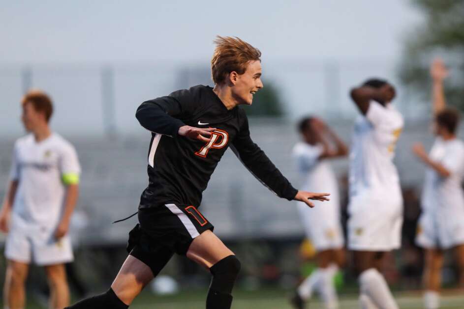 Prairie’s Gavin Lewis (10) runs to celebrate the winning goal with his teammates during the boys substate soccer game on Monday, May 23, 2022, at Prairie High School in Cedar Rapids, Iowa. (Geoff Stellfox/The Gazette)