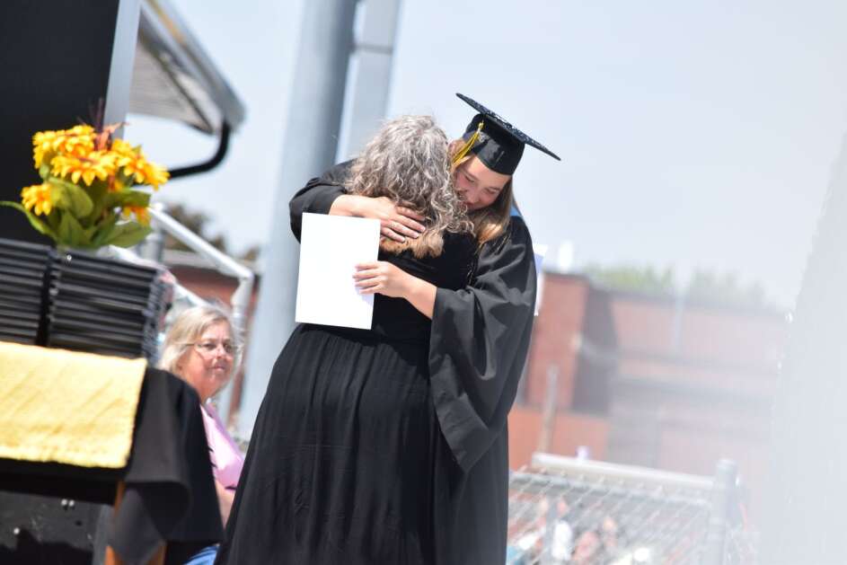 New London graduate Camryn Lair is pictured hugging her mom and teacher Allison Lair after being presented with an academic achievement award. (Hunter Moeller/The Union)