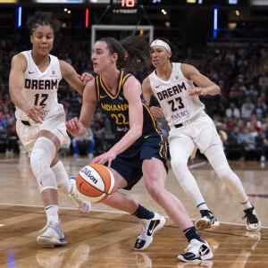 Raucous crowd roars its approval for Caitlin Clark in home debut with Fever