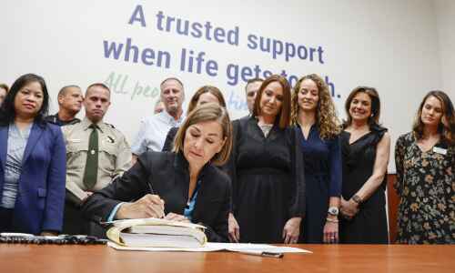 Reynolds signs overhaul of Iowa mental health, disability services into law