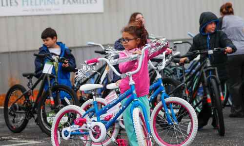 Cedar Rapids foster children receive new bikes and helmets