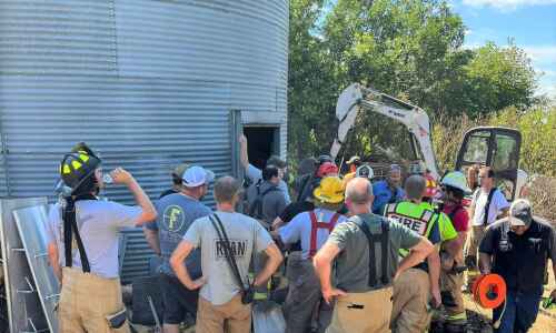 Crews rescue farmer trapped in grain bin overnight