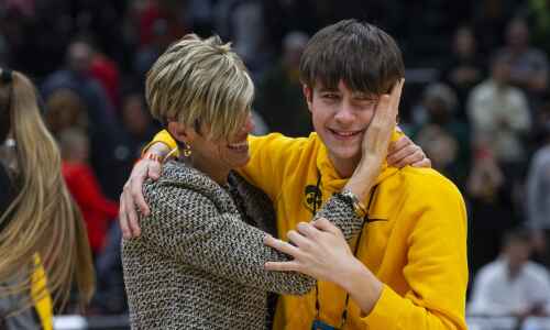 For Iowa assistant Jan Jensen, a day of loss, a night of victory