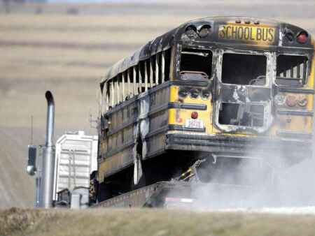 Iowa district to pay $4.8M to settle suit in fatal school bus fire