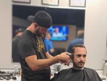 Former Iowa prison barber now owns his own shop