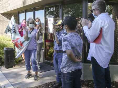 Vigil supporting Guatemalan immigrant in Iowa City confronts ICE