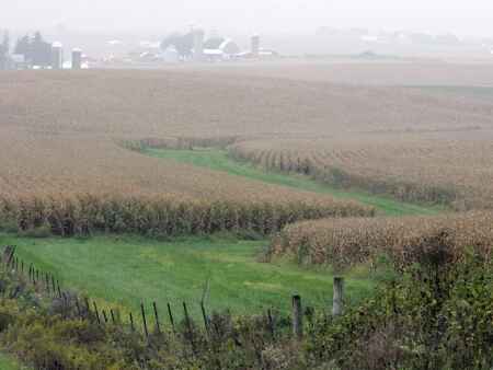 How might rising interest rates impact Iowa farmland values?