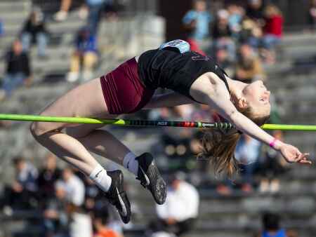 Two schools, two school records in the high jump for Sydney Maue