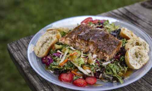 Pair heat and sweet with honey jerk salmon on a bed of greens
