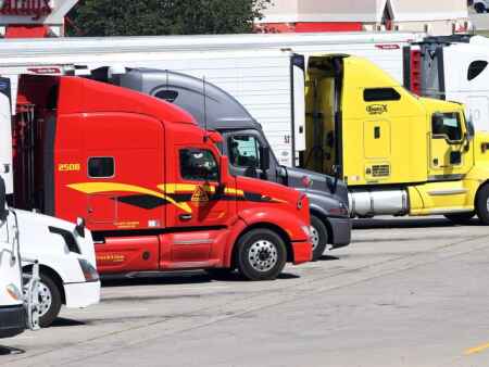 Iowa governor signs law limiting damages in trucking crash lawsuits