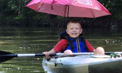 9-year-old and his dad kayak entire Cedar River to raise money for Make a Wish…