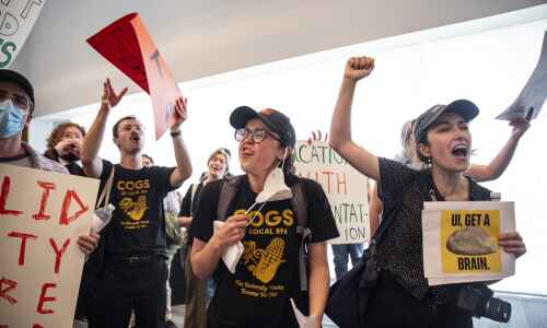 UI grad students shut down regents meeting, demand pay raise