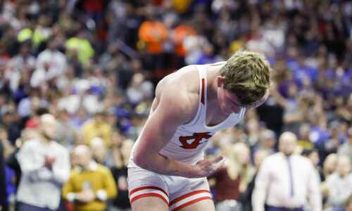 Ben Kueter takes a bow as undefeated, 4-time state champion