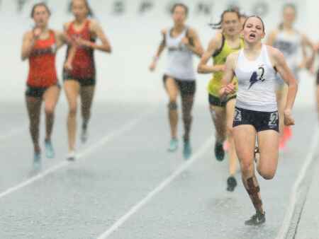 Soaked and triumphant, Ashley Keeney wins 4A 800 and 1,500