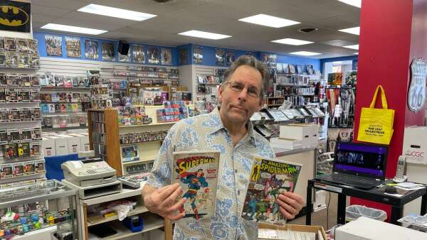 Business owner pushes reading by handing out free comic books